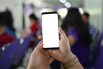 Hands using smartphone mockup empty screen.