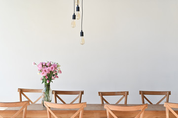 Copy space living room background with table, chair, flower and lamp.