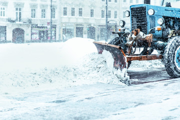 snowplow close up cleaning street of snow