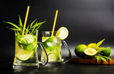 Lime cocktail with marijuana in a glass