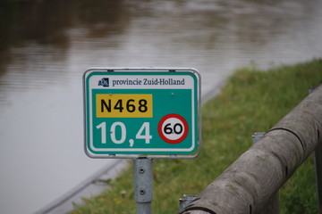 Distance sign on provincial road N468 at Schipluiden in the Netherlands with speed limit 60...