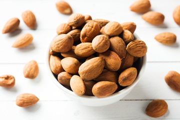 Almonds in a bowl. Selective focus. Close up