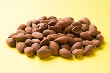 Almonds scattered on the table. Selective focus.