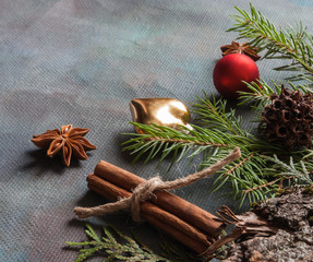 Happy Christmas. The concept of postcards, Christmas greetings, Christmas articles. Christmas cinnamon, tree branches, anise, cones. Close up. Selective focus. Copy space.