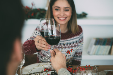 Young woman and man enjoy Christmas