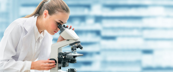Scientist researcher using microscope in laboratory. Medical healthcare technology and...