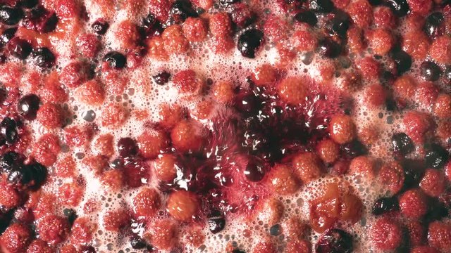 making fruit compote at home, berries are boiled in water