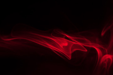 red smoke (evaporation) on a black background