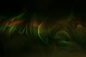 Yellow, green smoke (evaporation) on a black background