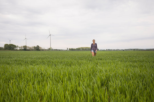 Agricultural worker walking through field