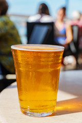 Close up shot of a glass of cold beer