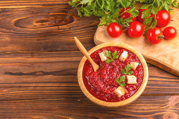 Bright fresh tasty pureed tomato soup with ingredients