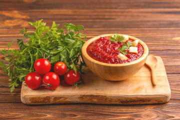 Bright fresh tasty pureed tomato soup with ingredients