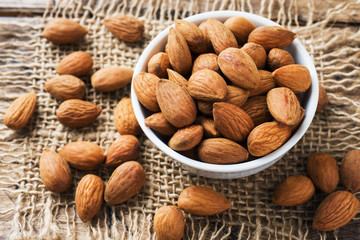 Almonds in a bowl. Selective focus Close up