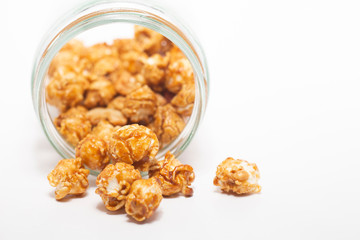 Caramel popcorn on white background.