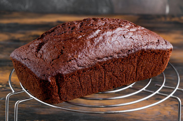 Baked chocolate cake on the wooden rustic table