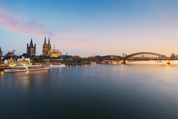 Fototapeta na wymiar Image of Cologne with Cologne Cathedral with Rhine river and Hohenzollern bridge during twilight blue hour in Germany.