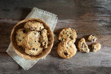 Cookies homemade in wooden  bowl on wood table 