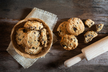 Cookies homemade in wooden  bowl on wood table 