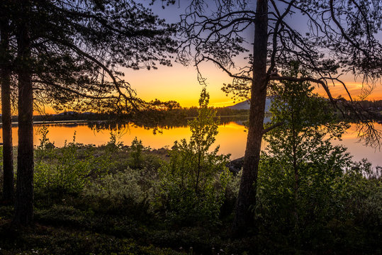 Midnight sun over a lake in Arjeplog, Sweden