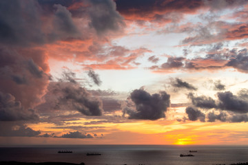 Magnificent colored clouds on the sea at sunset in the evening