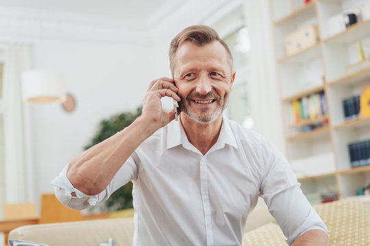 Older Man Listening To A Mobile Call