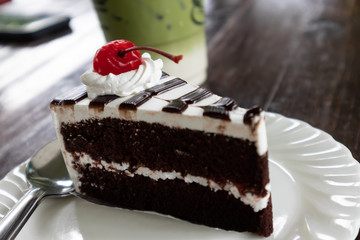 Delicious Chocolate cake and  sherry in white plate
