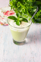 Green detox smoothie with avocado, herbs and yogurt