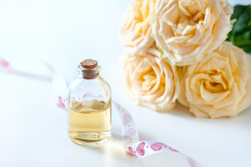 Glass jar with rose water and aromatherapy, copy space for text.