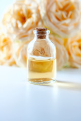 Glass jar with rose water and aromatherapy, copy space for text.