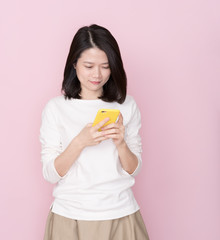 Asian female on pink background