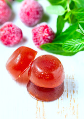 Homemade Strawberry jelly with mint and berries in on the background of wooden boards