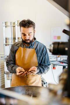 Small business owner working in his coffee roaster shop