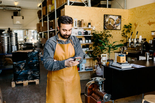 Small business owner in his coffee roaster shop