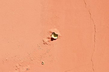 Texture of cracked wall. Old terracotta painted background. Banner with cracks, scrapes, peeling, holes