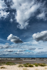 Naklejka na ściany i meble Scattered clouds over gulf of Riga, Baltic sea.