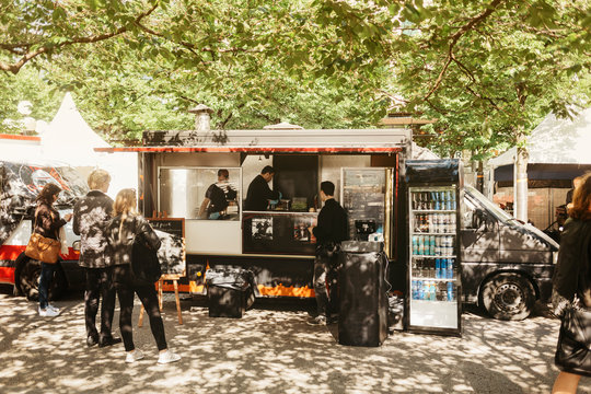 Customers waiting at food truck for their burgers
