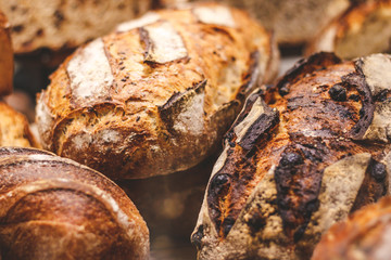 Breads on a showcase in a French bakery. Soft focus, close up view.