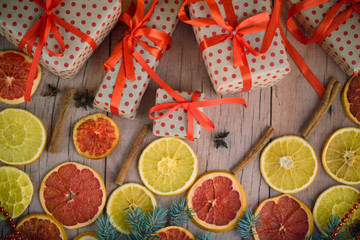 New Year's gifts with red ribbon. Packing Christmas gifts. Garland with lights. New Year.