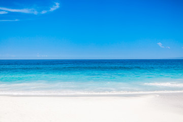 Tropical white beach with blue ocean in paradise island