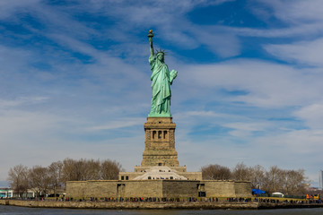 Front view of The Statue of Liberty on Liberty island with blue sky background, Landmarks of New York City, USA © Thongchai S.