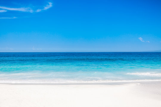 Tropical white beach with blue ocean in paradise island