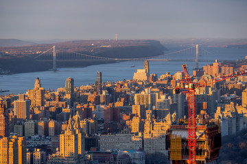 Amazing New York city skyline and skyscraper at sunset with Hudson river and bridge background