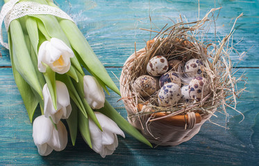 Naklejka na ściany i meble easter composition consists of a white tulips, quail eggs