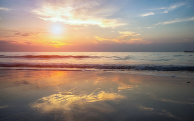 Beautiful beach with soft wave of the sea on the sandy beach. Beautiful sunrise in early morning at the Samed Island in Thailand.