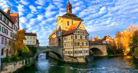 Beautiful places of Germany- Bamberg in Bavaria. View with townhall over the bridge - obrazy, fototapety, plakaty