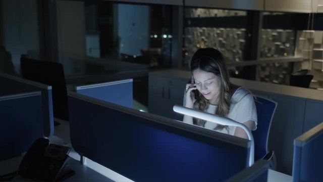 Business Woman Talking With Client On Phone At Night