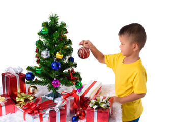 Happy asian child holding red ball for decoration Christmas tree. Christmas or happy newyear time