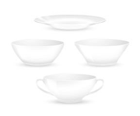 Set of empty white plates and bowls. Kitchen utensils isolated on a white background
