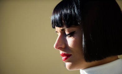 Makeup bright accent on lips. Red lipstick makeup suits her. Perfect makeup for brunette lady....
